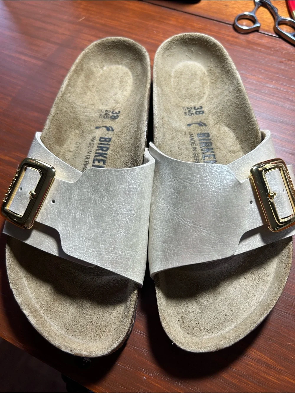Birkenstock White Single-Strap Slide Sandals with Gold Buckles
